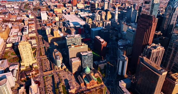 Hectic traffic on the multi-lane highways with numerous bridges across them. Drone footage over the sunny scenery of Philadelphia, Pennsylvania, USA.