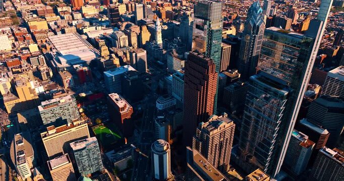 Stunning downtown of modern Philadelphia, Pennsylvania, USA. Transport moves in the lively traffic by the highways. Aerial view.
