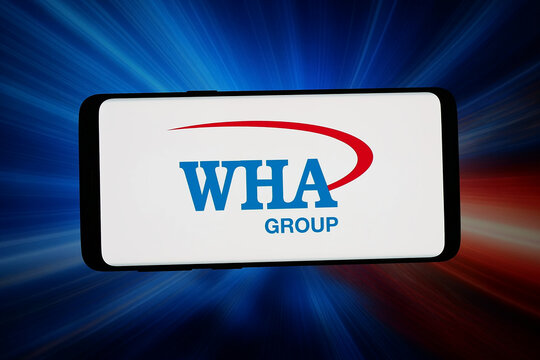 Stuttgart, Germany - 04-10-2026: In this photo illustration, the logo of Thai logistics company WHA Corporation PCL is displayed on a smartphone in front of abstract background on computer screen.