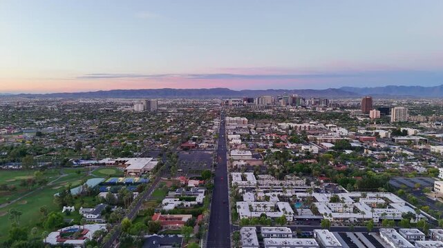 Aerial view of North 7th Street stretching towards the downtown skyline under a dawn sky, Phoenix, Arizona, United States.