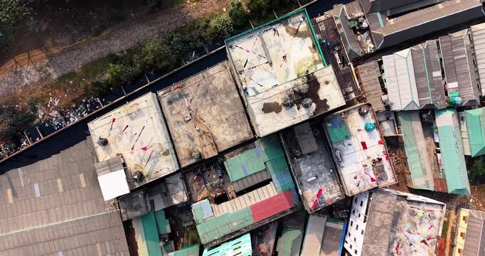 Aerial view of a densely populated urban area with green spaces and waste city town