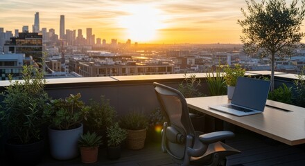 Obraz premium Rooftop Workspace with Laptop at Golden Hour Sunset