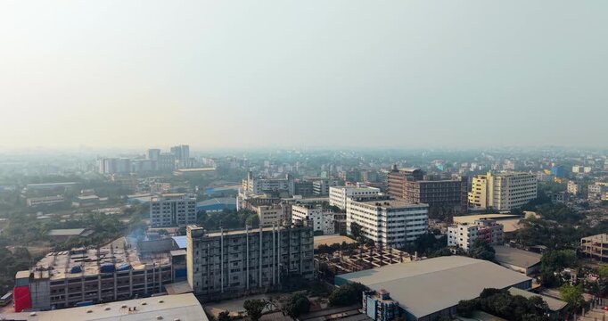 Aerial view of a densely populated urban area with industrial buildings and residential high-rises city