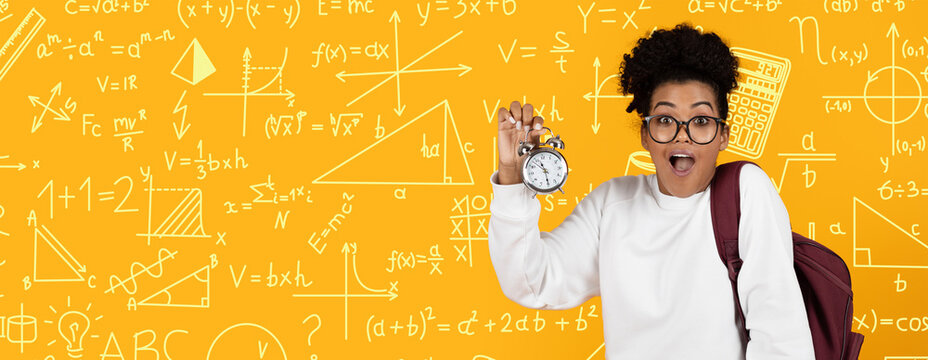 A student stands against a bright yellow background filled with math symbols and equations. They hold a stopwatch and smile. The scene shows excitement for learning.