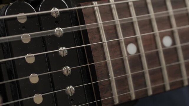 electric guitar strings close up string vibrates and makes sound