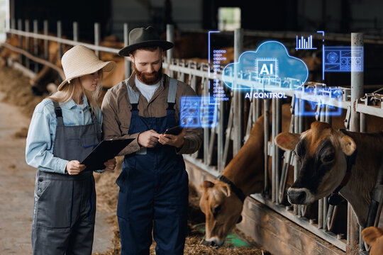 Farm workers inspecting dairy cows with ai assistant monitoring system for agricultural management and technology