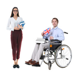 Obraz premium Equality and inclusion. Teacher in wheelchair and his colleague on white background