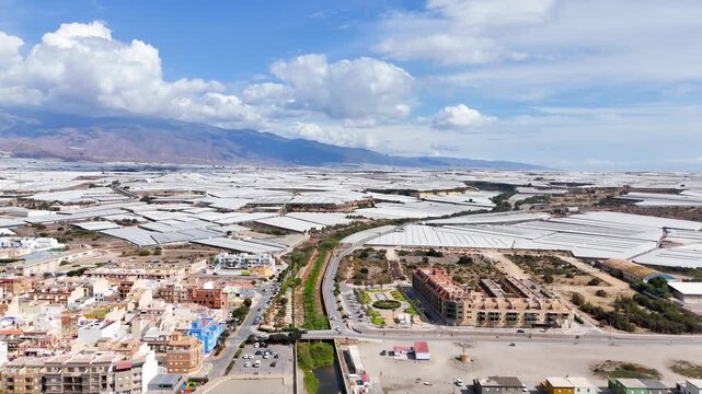 greenhouse rural landscape plastic sea drone business field agriculture vacation travel aerial nature control terra forming city town river - Balerma, Andalusia, Spain - 2025