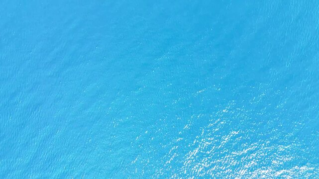 blue sea texture water sunlight wave perfect gradient ocean lake liquid motion drone plan material - Andalusia, Spain - 2025