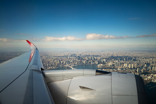 view from airplane window taking off over Tokyo, Japan