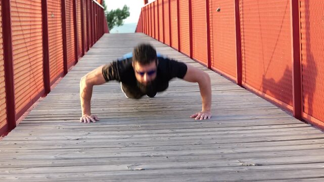 strong man training push up on bridge