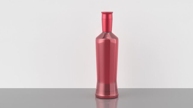 Red liqueur bottle on a shiny grey table