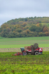 Obraz premium Sugar beet harvester working field in Vert Toulon, France