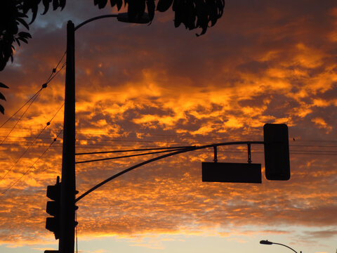 Dramatic Sunset Clouds with Traffic Light Silhouette