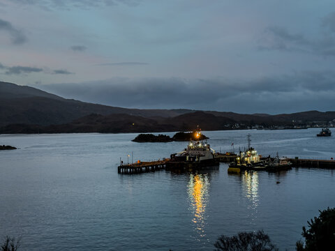 View of the beautiful Portree Harbour  and town, with Colorful Houses, Isle of Skye Scotland &ndash; Scenic Coastal Village Landscape