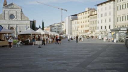 Soft defocused city square market scene with rows of tents and a distant cathedral facade, empty feel  background, backdrop, copyspace, template. © Krakenimages.com