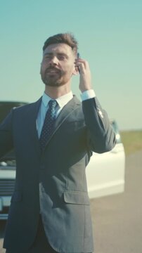 Entrepreneur expresses elation upon finalizing important agreement despite previous vehicle failure outdoors