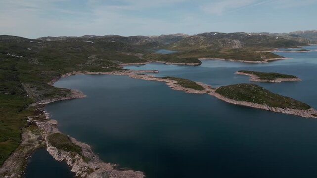 Peaceful place next to the road in Norway full of spring water in river in summer