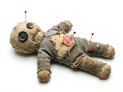 Businessman voodoo doll lying on white background, symbolic business stress and control concept in conceptual photography
