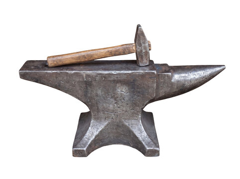 Rustic blacksmith's anvil with metal hammer resting on top