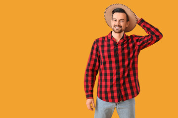Handsome man on yellow background. Festa Junina (June Festival) celebration