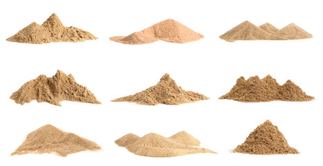 Heaps of sand on white background © Pixel-Shot