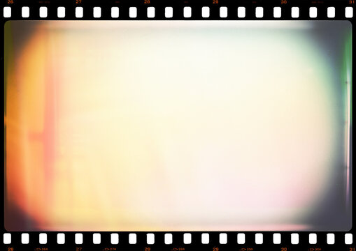 35mm photo film strip with white dusts and scratches and strong lens vignetting with red glare light leak, A4 aspect ratio page template with transparent background (PNG image)	
