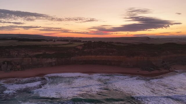 Gibson Steps and Port Campbell National Park, Great Ocean Road, Victoria, Australia at sunrise: 4K aerial drone footage of cliffs, beach, ocean waves and coastal landscape near Twelve Apostles.