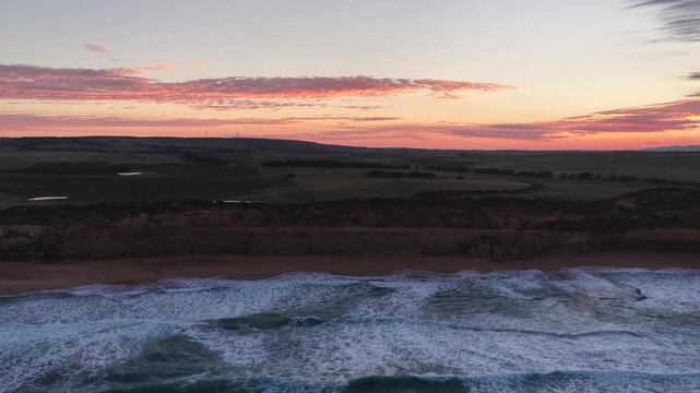 Gibson Steps and Port Campbell National Park, Great Ocean Road, Victoria, Australia at sunrise: 4K aerial drone footage of cliffs, beach, ocean waves and coastal landscape near Twelve Apostles.