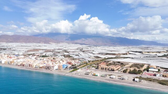 plastic sea landscape drone greenhouse agriculture field aerial cloudscape invernaderos vacation city travel town beach coast coastline water mountain farming - Balerma, Andalusia, Spain - 2025