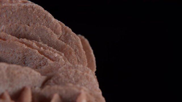 A macro of desert rose crystal or sand rose (a rose-like formations of crystal clusters of gypsum and sand grains)� isolated on a black background