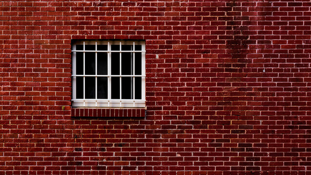 Industrial Red Brick Wall with Secured Window