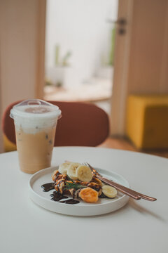 Savoring morning bliss waffles and coffee delight indoor cozy setting relaxed atmosphere inviting food photography