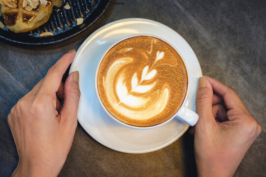 Creating stunning latte art in a cozy  captured from above showcasing coffee culture