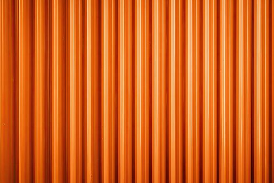 Vibrant orange corrugated surface with vertical parallel ridges creating a textured background