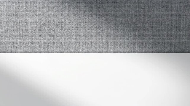 Minimalist background with a textured gray wall and a clean white surface, perfect for product display or graphic design projects background