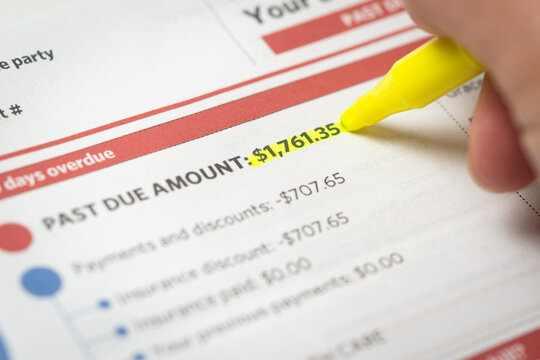 A medical bill showing a past due amount highlighted with a yellow marker, emphasizing financial obligations, overdue payments, and personal finance management.