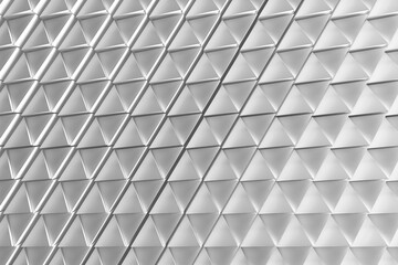 Obraz premium Metallic triangular tile pattern with repeating facets for modern architectural texture and background design.3d render