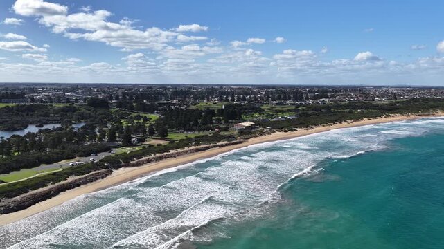 Warrnambool, Victoria, Australia: 4K aerial drone footage of coastal town, sandy beaches, ocean waves, wetlands, E Johnson Reserve, river inlets and urban landscape with houses, shops and streets