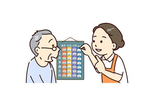 薬の管理　薬を日ごとに分けて高齢者が飲み忘れないように説明する家族又は介護士