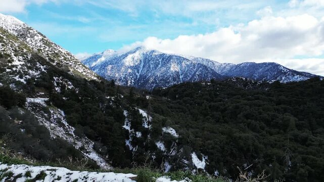 The California San Gorgonio San Bernardino Mountain Range near the Santa  Ana Watershed covered in snow along SR 38 through the Mountain Pass