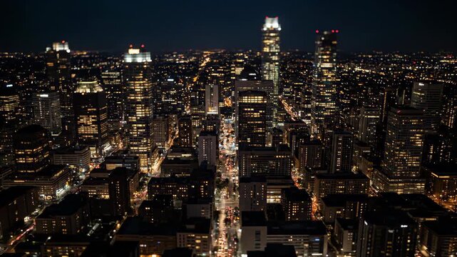 Night time cityscape with illuminated buildings and streetlights. Urban view at dusk and dark for city living.