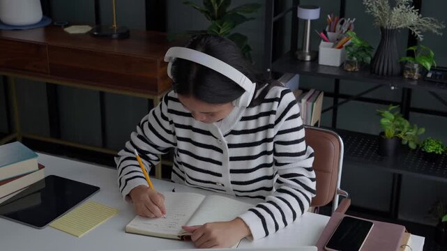 Asian Woman Studying Online on Laptop