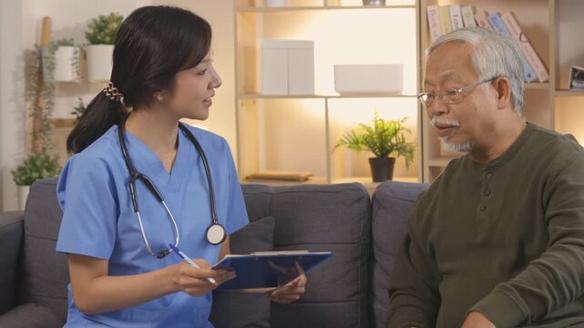 Senior patient receiving comfortable home care from supportive nurse and caregiver, talking through medical consultation for comprehensive healthcare at night