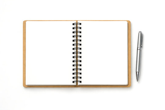 Spiral bound notebook and silver pen on white background