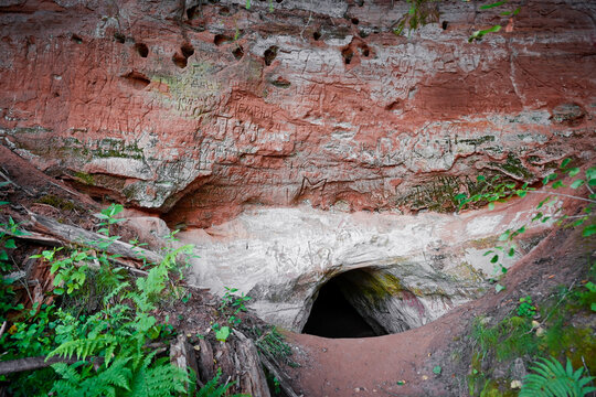 Narrow passage into underground caves near the village of Borshchevo, Leningrad region of Russia