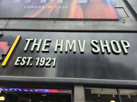 London UK 06.07.2025 The HMV Shop storefront sign with bold lettering and established date on modern facade representing iconic british music retail brand in urban setting