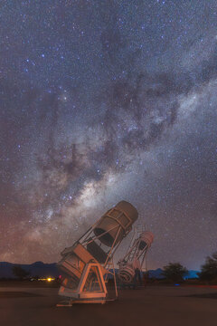 View of telescopes at San Pedro de Atacama celestial observations Spaceobs under the Milky Way and starry night sky in Solor, Antofagasta, Chile.