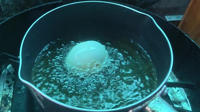 Deep frying food in the pot. Effective method for crispy food.