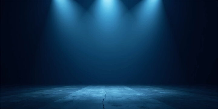 A bright blue spotlight beam shines onto a dark theater stage to create an illuminated glow for a music concert show backdrop